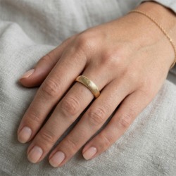 fingerprint band ring in 9ct yellow gold. fingerprint on the outside on female hand