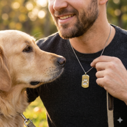 dogtag style sterling silver pendant with dog paw print engraved