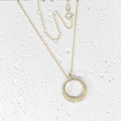 Name Jewellery in round shape on a multi fit curb link chain. The pendant is custom made in Australia from 9ct solid gold.