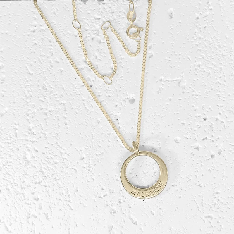 Name Jewellery in round shape on a multi fit curb link chain. The pendant is custom made in Australia from 9ct solid gold.
