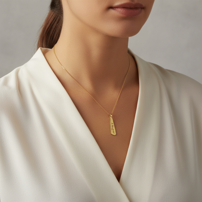 gold pendant with a loved ones signature