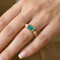 gold ring with two diamonds in rise gold featuring cremation ashes